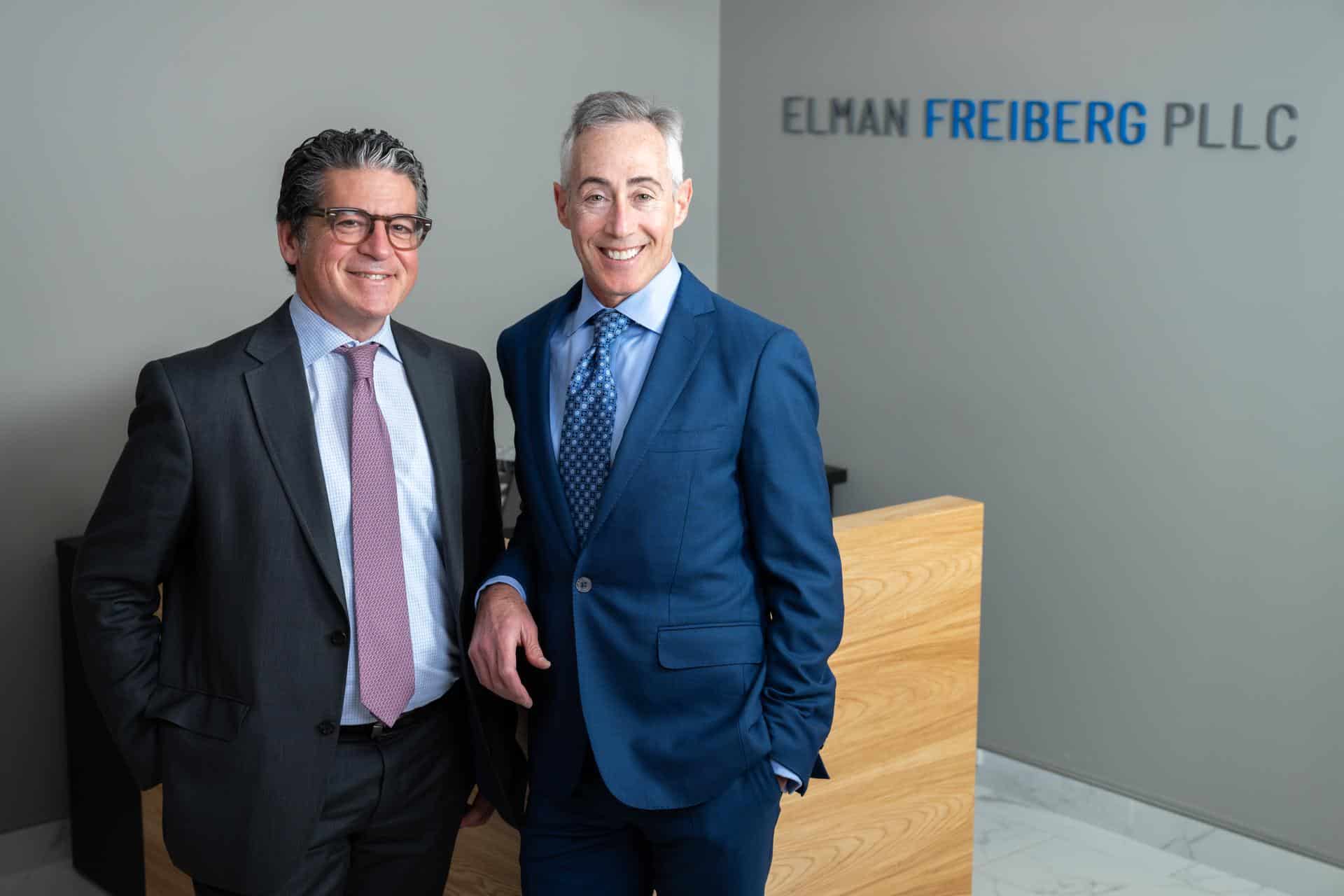 Photo of Elman and Freiberg standing in office